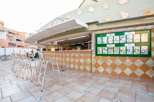 a row of stools in front of a restaurant at Orlando 85 in Adeje