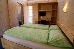 Rúm í herbergi á Familienhotel Campagna
