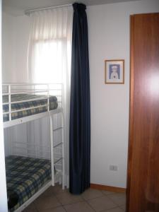 Двох'ярусне ліжко або двоярусні ліжка в номері Ilios Residence