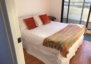Rúm í herbergi á B&B Hostel CasaMoro