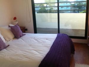Rúm í herbergi á B&B Hostel CasaMoro