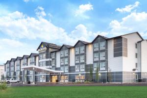 a rendering of the exterior of a hotel at Microtel Inn & Suites by Wyndham Fort McMurray in Fort McMurray