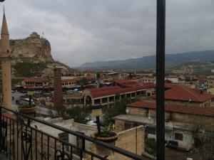 a view of a city with a mountain in the background at Dar Konak Pansiyon in Urgup