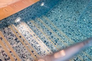Bazén v ubytování DAS BADL - Smart Retreat AO nebo v jeho okolí