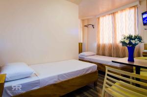 Postel nebo postele na pokoji v ubytování Diamond Hotel And Resto