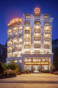 a building with a sign that reads welcome to the worst hotel at The View Sapa Hotel in Sa Pa