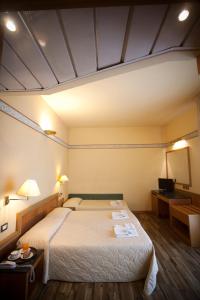 Postel nebo postele na pokoji v ubytování Hotel Marina Bay