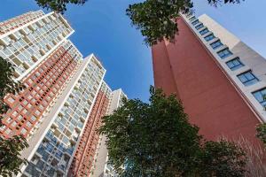 two tall buildings standing next to each other at Henan Kaifeng·Henan University· Locals Apartment 00170030 in Kaifeng
