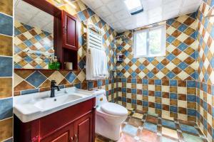 a bathroom with a toilet and a sink at Chengdu Qingyang·Kuanzhai Alley· Locals Apartment 00170590 in Chengdu
