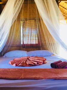 Postel nebo postele na pokoji v ubytování Koh Phaluai Beach Bangalow