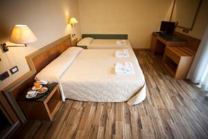 Postel nebo postele na pokoji v ubytování Hotel Marina Bay