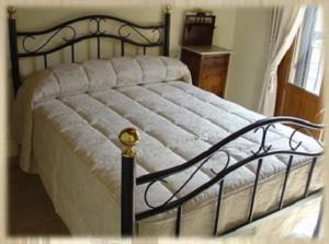 Una cama o camas en una habitación de Apartamentos Los Hebiles