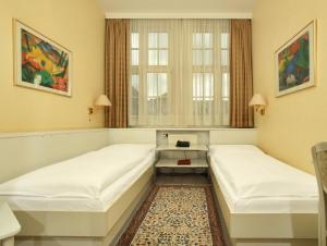 Postel nebo postele na pokoji v ubytování Hotel Bellmoor im Dammtorpalais