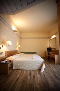 Postel nebo postele na pokoji v ubytování Hotel Marina Bay
