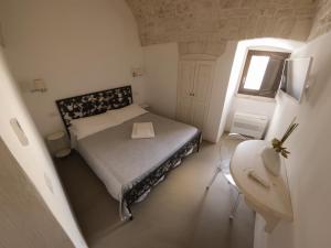 Postel nebo postele na pokoji v ubytování Terrazza Sui Trulli