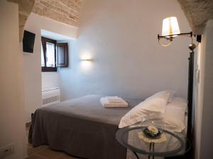 Postel nebo postele na pokoji v ubytování Terrazza Sui Trulli