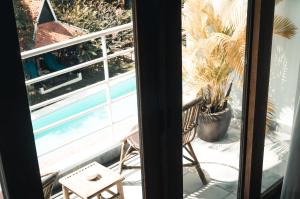 a balcony with a view of a swimming pool at iRoHa Garden Hotel & Resort in Phnom Penh