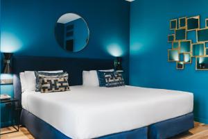 Posteľ alebo postele v izbe v ubytovaní Arenas Atiram Hotel