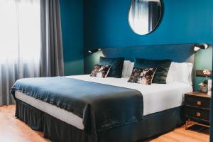 Posteľ alebo postele v izbe v ubytovaní Arenas Atiram Hotel