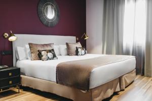 Posteľ alebo postele v izbe v ubytovaní Arenas Atiram Hotel