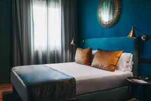 Posteľ alebo postele v izbe v ubytovaní Arenas Atiram Hotel