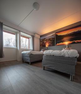 Postel nebo postele na pokoji v ubytování Abisko Hostel