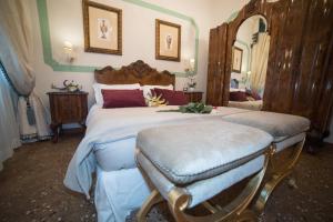 Voodi või voodid majutusasutuse Ca' Dell' Arte Luxury toas