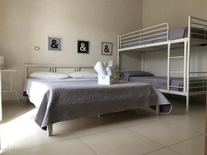 Postel nebo postele na pokoji v ubytování B&B La Via di Casa