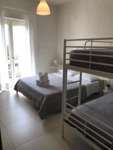 Postel nebo postele na pokoji v ubytování B&B La Via di Casa