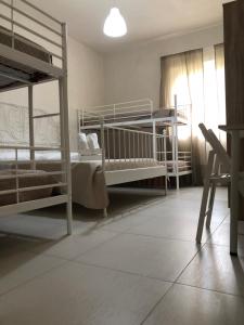 Postel nebo postele na pokoji v ubytování B&B La Via di Casa