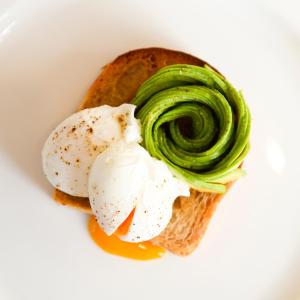 a piece of bread with vegetables on top of it at Whatley Manor in Malmesbury