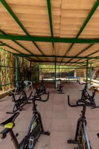 a group of bikes parked under a building at Club Hotel Residence Baiaverde in Valledoria