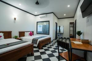 Cama o camas de una habitación en Noni Tree Hostel