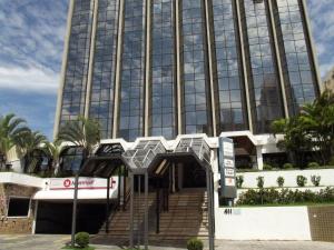 a large glass building with a staircase in front of it at L'Hirondelle Flat Service in Campinas