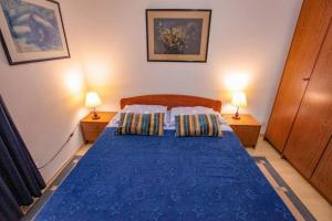 Ένα ή περισσότερα κρεβάτια σε δωμάτιο στο Vila Pinet