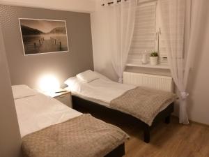 Postel nebo postele na pokoji v ubytování Pokoje gościnne Venezia