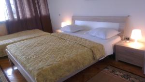 Posteľ alebo postele v izbe v ubytovaní Rooms Krnić