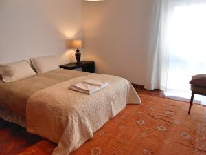 Katil atau katil-katil dalam bilik di Cacao Estoril Apartment