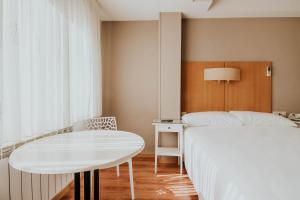 Postel nebo postele na pokoji v ubytování Hotel Isasa