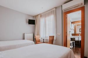 Postel nebo postele na pokoji v ubytování Hotel Isasa