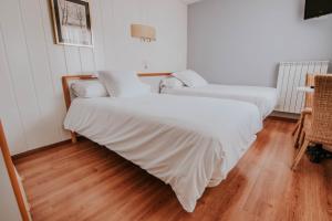 Postel nebo postele na pokoji v ubytování Hotel Isasa