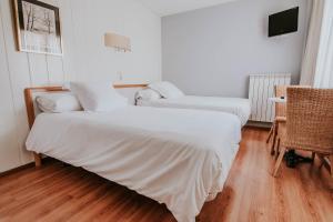 Postel nebo postele na pokoji v ubytování Hotel Isasa