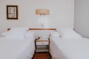 Postel nebo postele na pokoji v ubytování Hotel Isasa