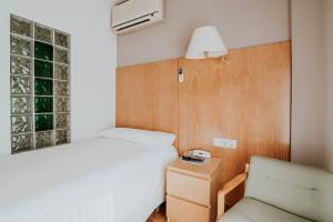 Postel nebo postele na pokoji v ubytování Hotel Isasa