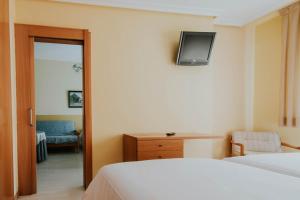 Postel nebo postele na pokoji v ubytování Hotel Isasa