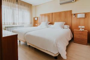 Postel nebo postele na pokoji v ubytování Hotel Isasa