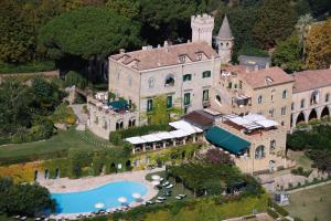 an aerial view of a mansion with a swimming pool at Hotel Villa Cimbrone in Ravello