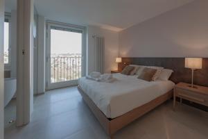 A bed or beds in a room at LAMIA MATERA 11