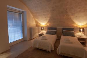 A bed or beds in a room at LAMIA MATERA 11