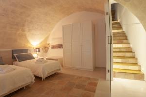 A bed or beds in a room at LAMIA MATERA 11